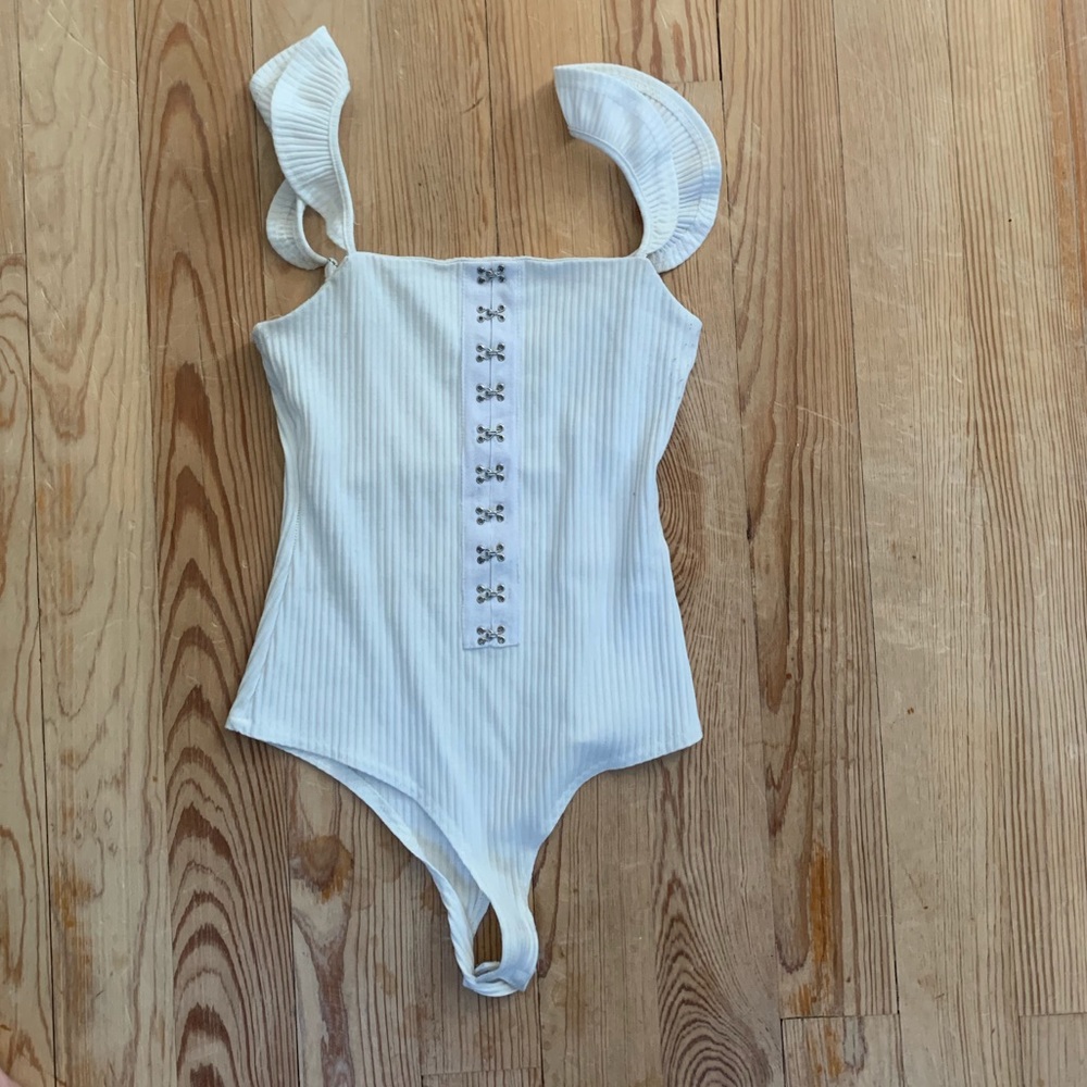 White clasped bodysuit with shoulder ruffle!